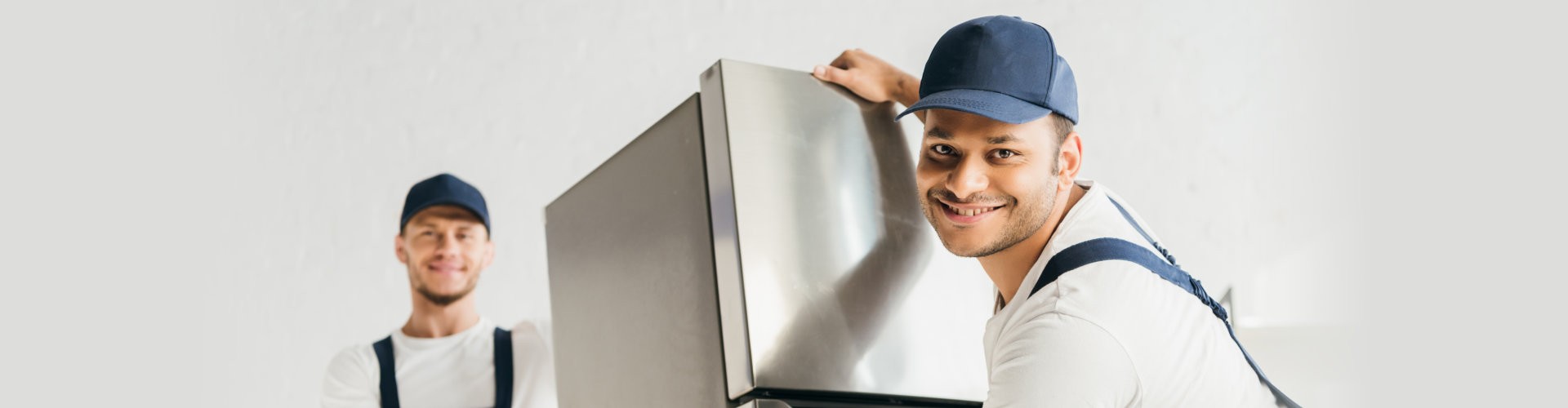 mover in uniform moving fridge